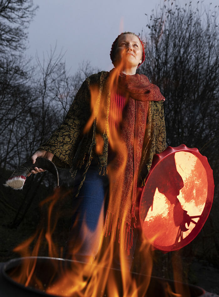 image of woman with shaman drum and fire